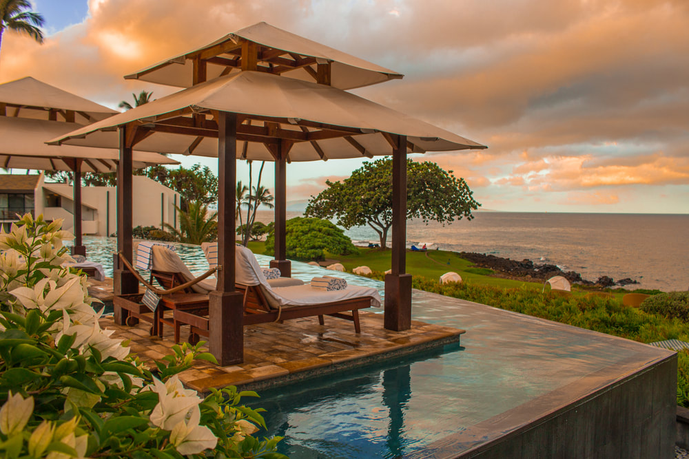 resort pool with cabanas